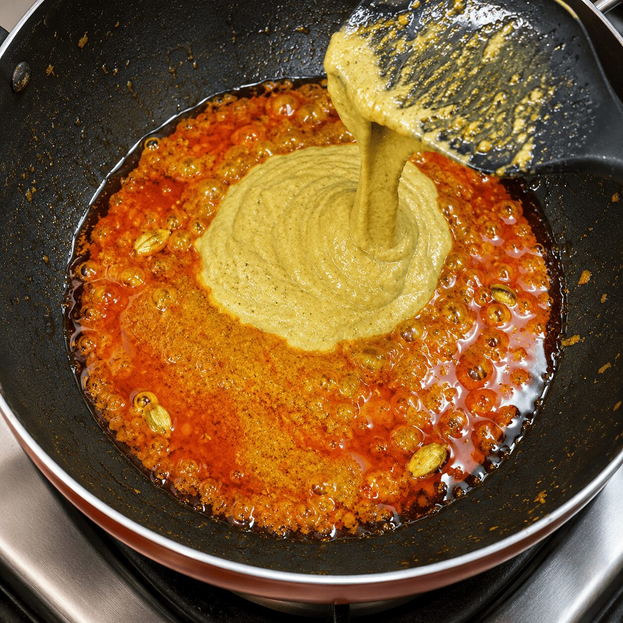 Blending onion, cashew, and green chilli into a fine paste for Anda Korma