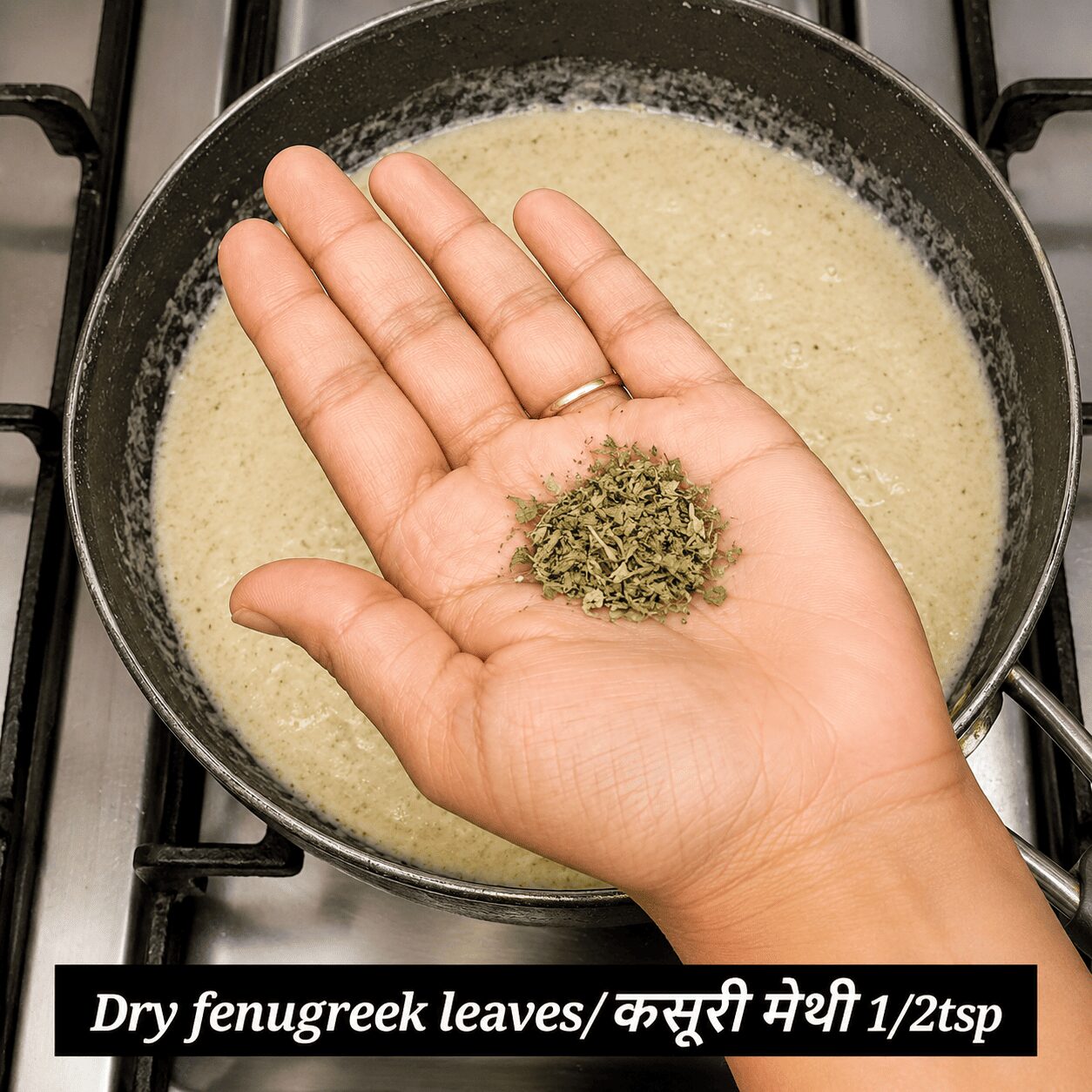 Crushing kasuri methi by hand into the Anda Malai Curry gravy