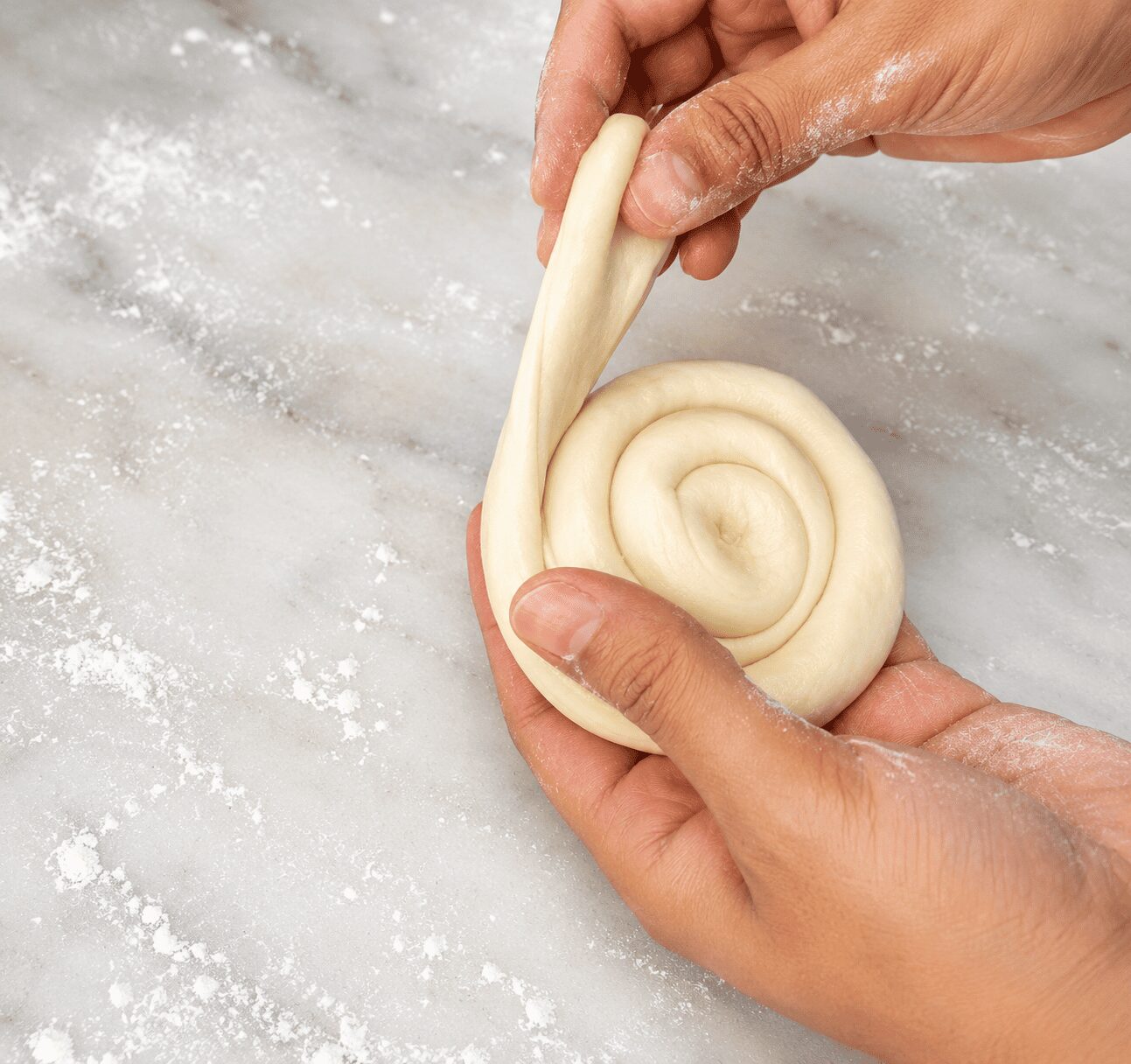 Double-rolled peda resting before final rolling for Anda Paratha Roll