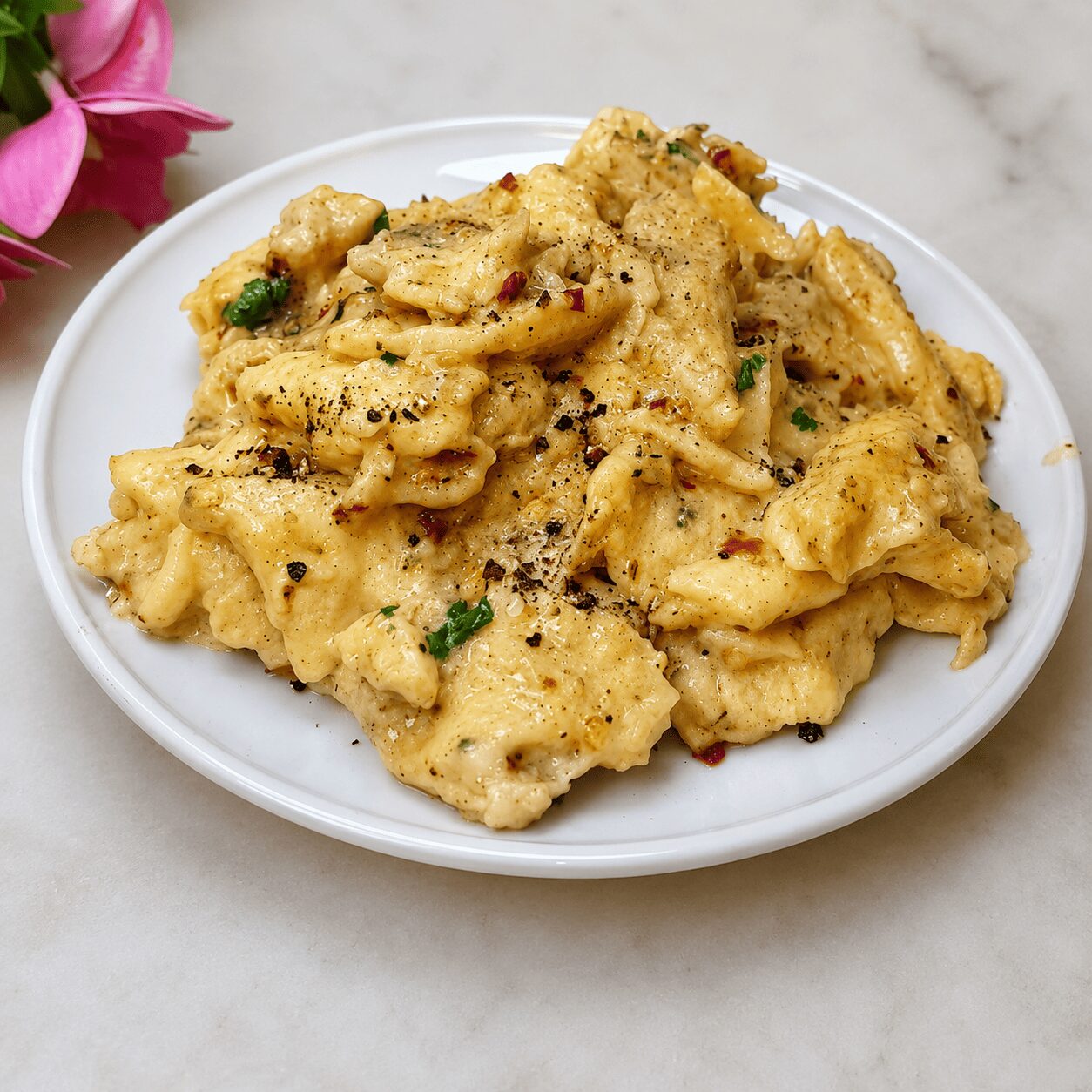 Finished Butter Garlic Egg garnished with fresh coriander