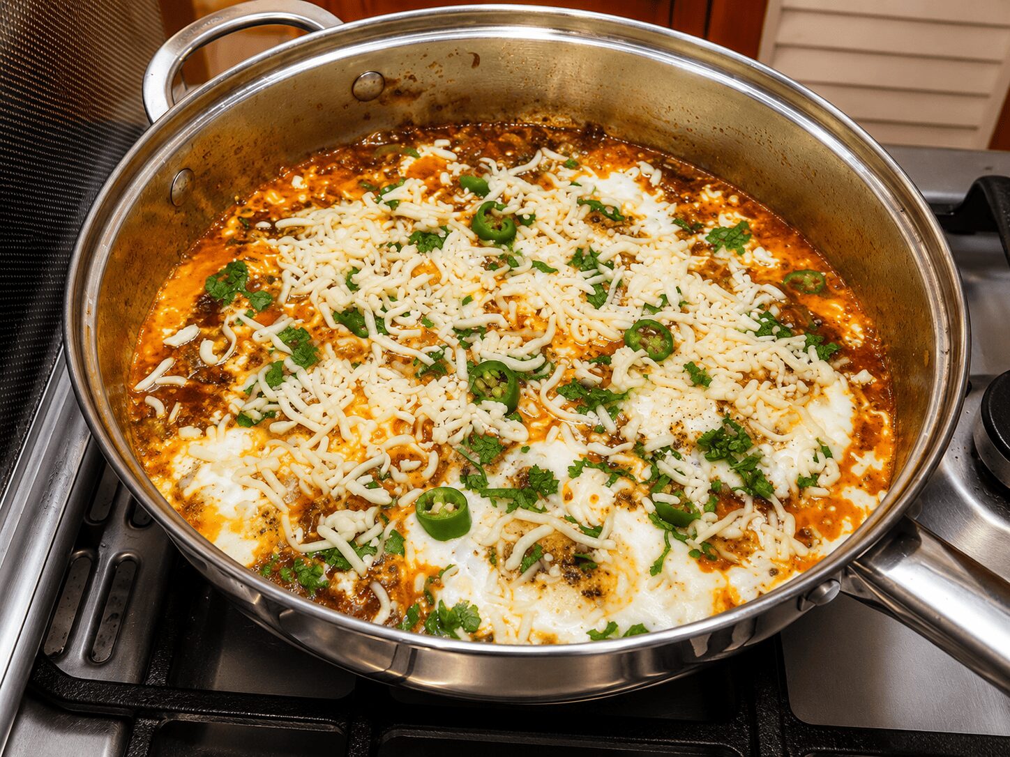Finished Egg Shakshuka with optional melted mozzarella on top