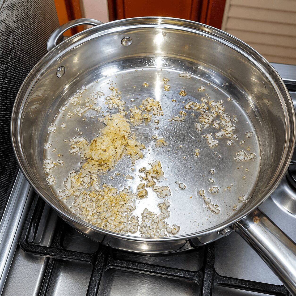 Frying garlic then ginger separately for Egg Shakshuka