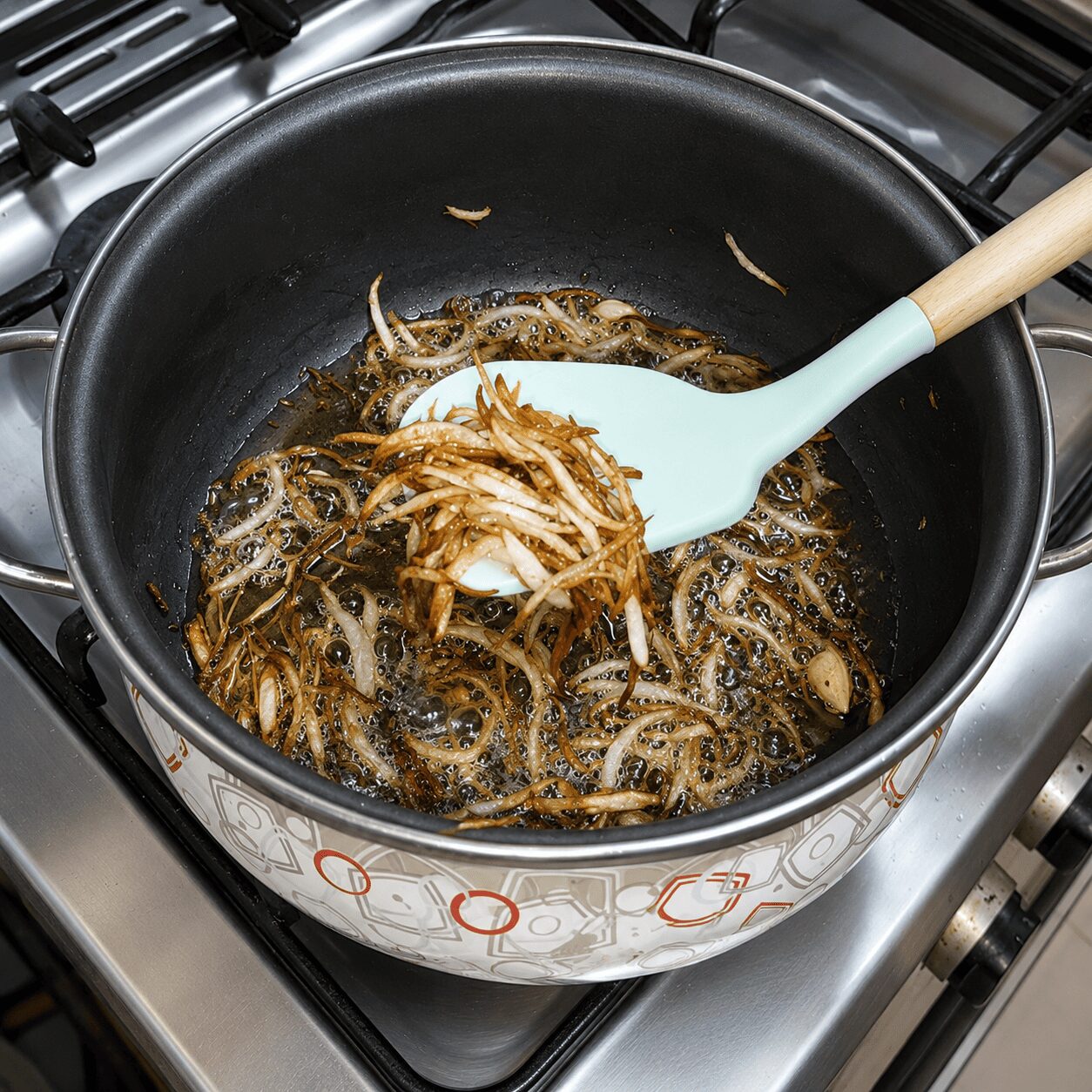 Frying onion golden and reserving some for garnish, Muradabadi Anda Yakhni Pulao