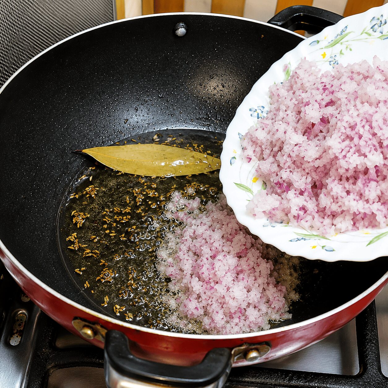 Onion fried light golden with whole spices for Mughlai Shahi Egg Curry