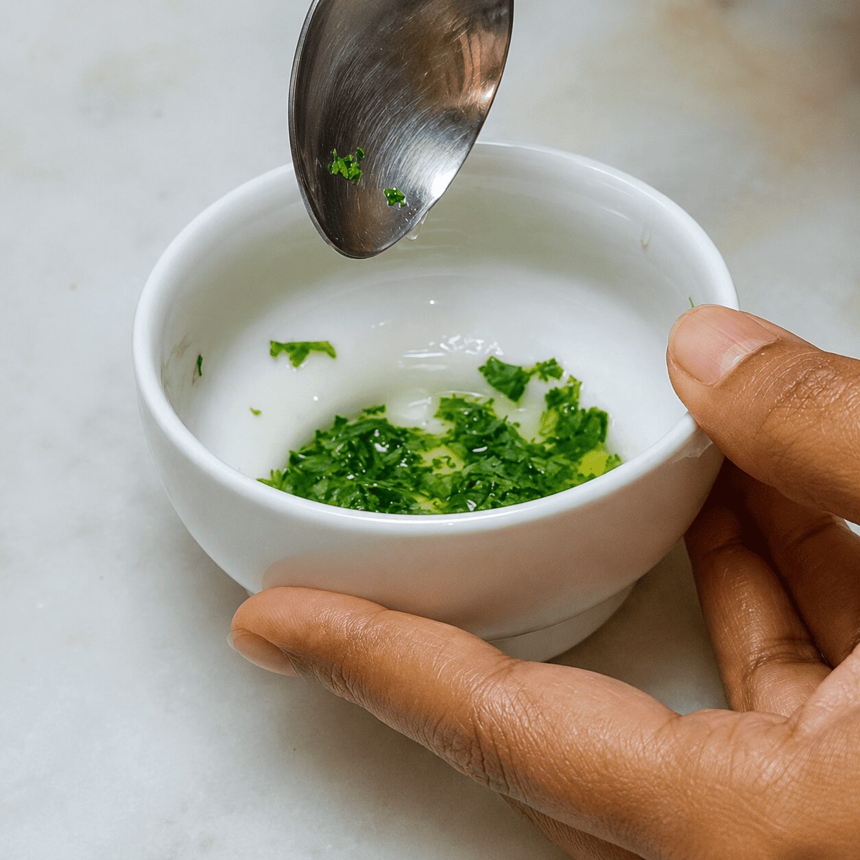 Parsley-infused olive oil prepared separately for Turkish Eggs Çılbır
