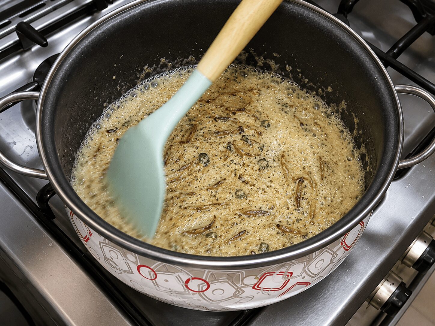 Roasting yogurt brown into the onion masala for Muradabadi Anda Yakhni Pulao
