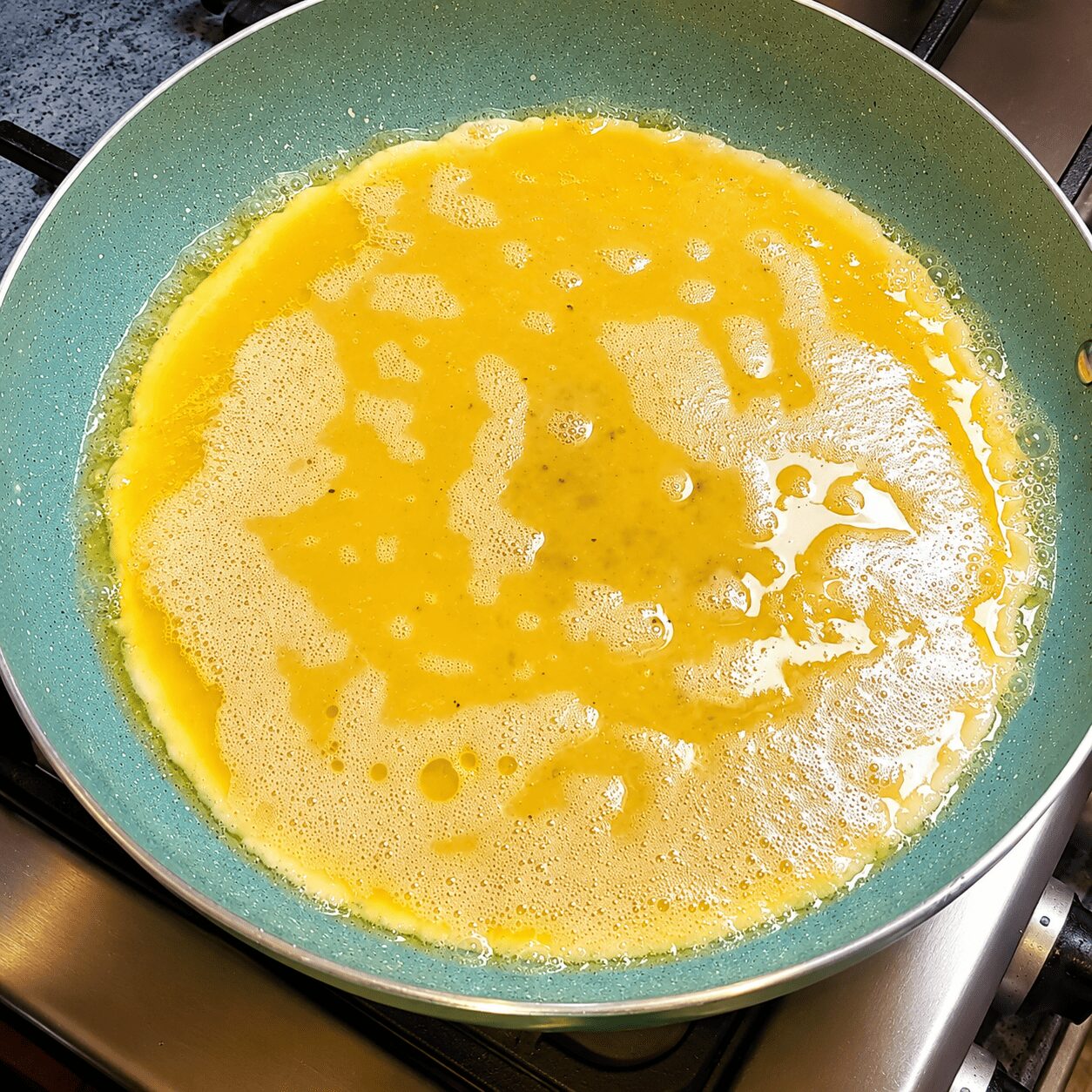 Scrambled eggs cooked into thick, fluffy pieces for Butter Garlic Egg