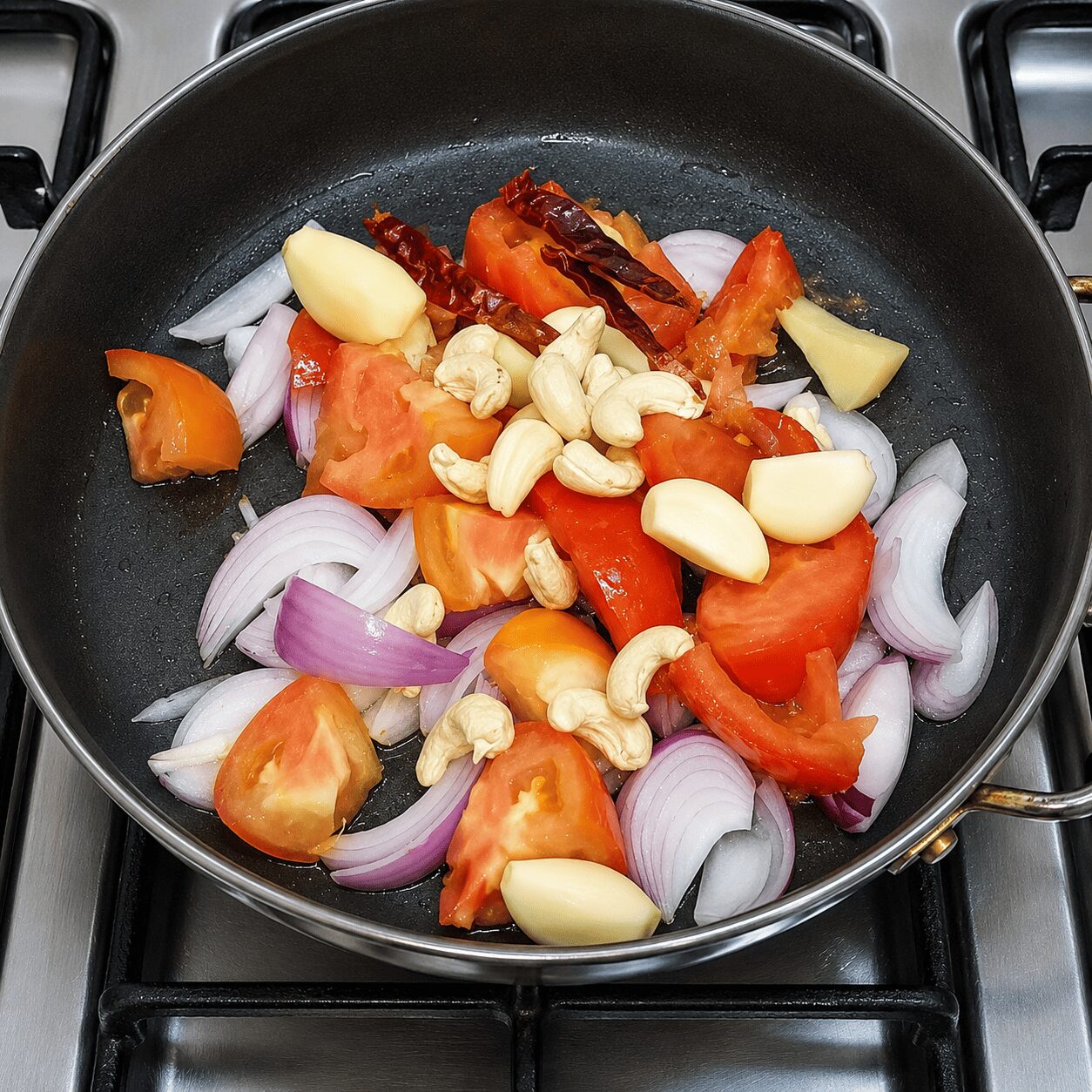 Simmering onion, tomato, garlic, and cashews for Egg Butter Masala purée